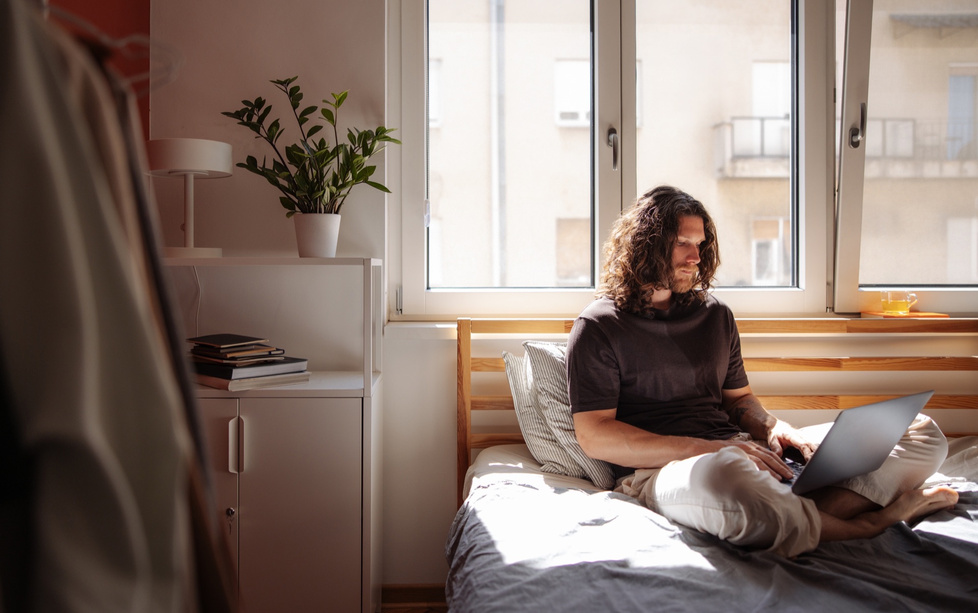 A clinician writing a therapy note on a laptop